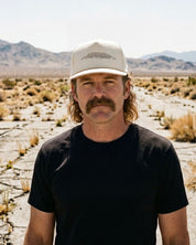 The Buckskin rope-brim snapback worn in the desert