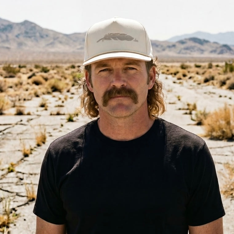 The Buckskin rope-brim snapback worn in the desert