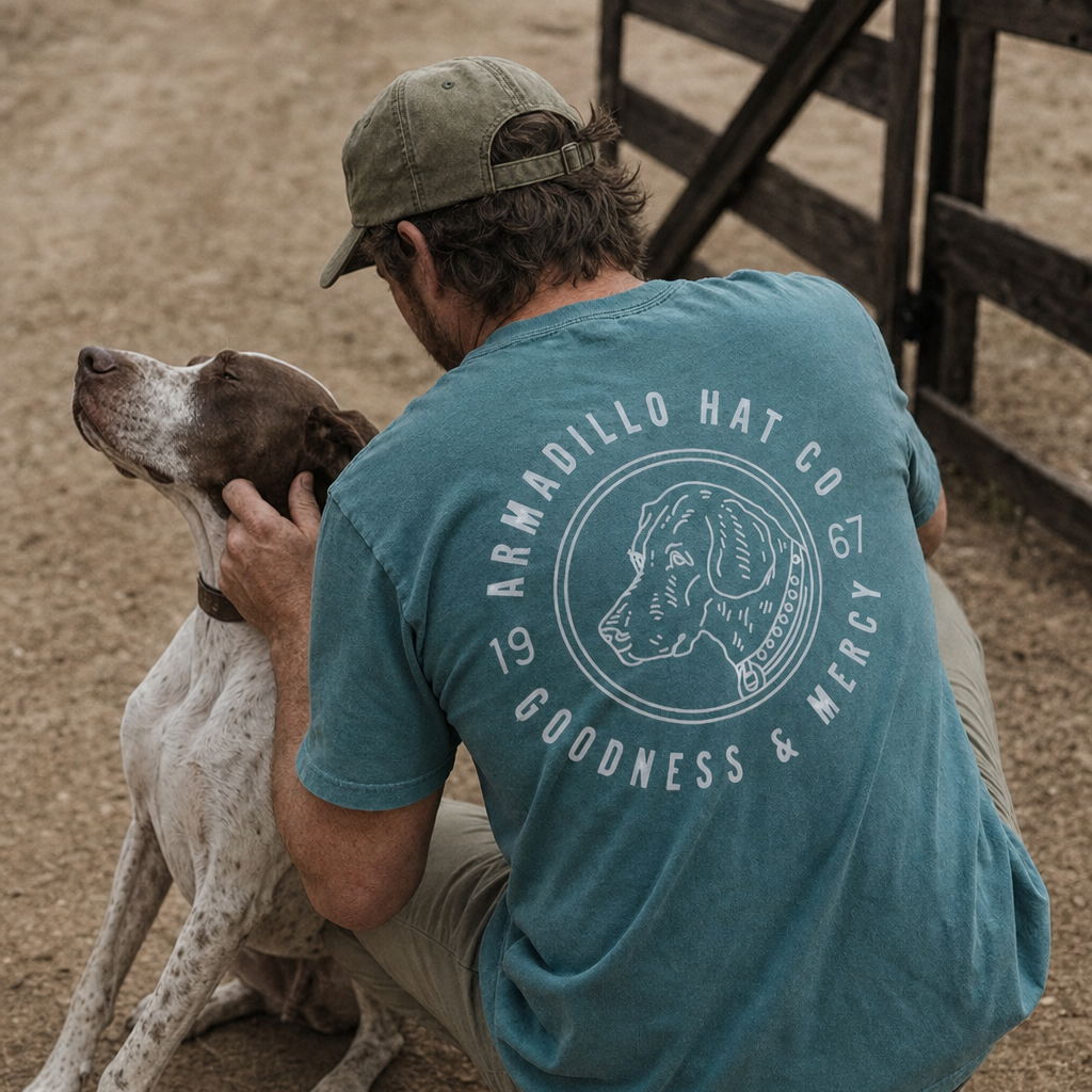 Man in the Bird Dog Tee with an English pointer on a ranch road